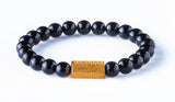 Black onyx 8 mm yellow gold